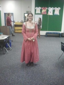 me in a pink 1580s Italian dress in a classroom