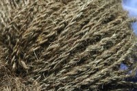 a skein of 2-ply handspun worsted yarn from black Leicester Longwool with flecks of silver