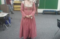 me in a pink 1580s Italian dress in a classroom